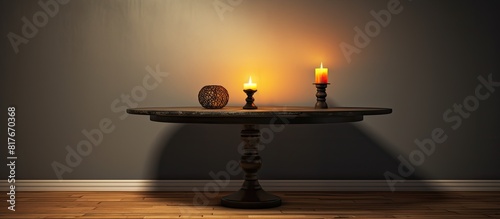 The decorative table features a candle positioned in the center providing a visually appealing copy space image