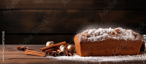 A copy space image of banana bread with powdered sugar on a wooden background photo