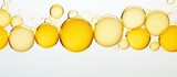 An image of yellow bubbles with a clean white background providing ample copy space