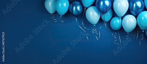 Top view of blue background with copy space featuring festive balloons for a carnival festival or birthday holiday