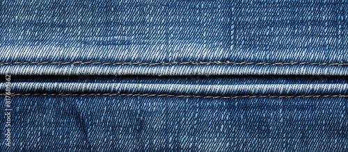 A close up image shows the texture of blue denim jeans highlighting the visible seams. Creative banner. Copyspace image