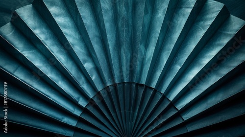 Highresolution image showing the intricate folds of a dark green fan  forming a soft  neutral  and symmetrical textured background