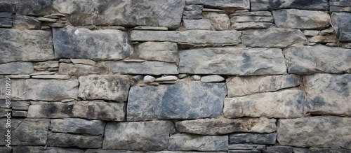 An aged stone wall with a rough texture serves as a perfect background image with copy space