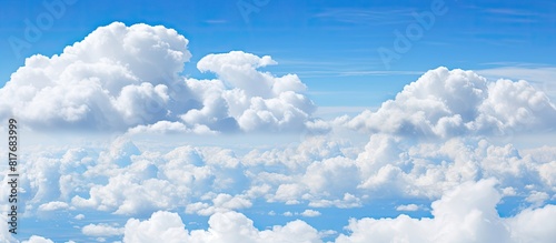 Skyward view of fluffy clouds adorning the picturesque copy space image