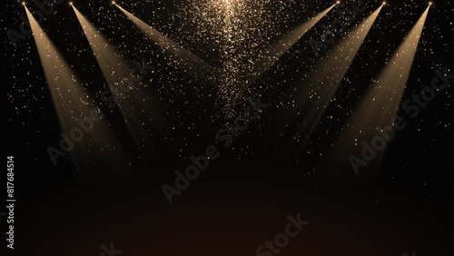 A spotlight illuminates the background of the stage. Spotlight with flying shiny glitter bright particles. Rays of golden color. Empty stage with light for product. 4k video photo