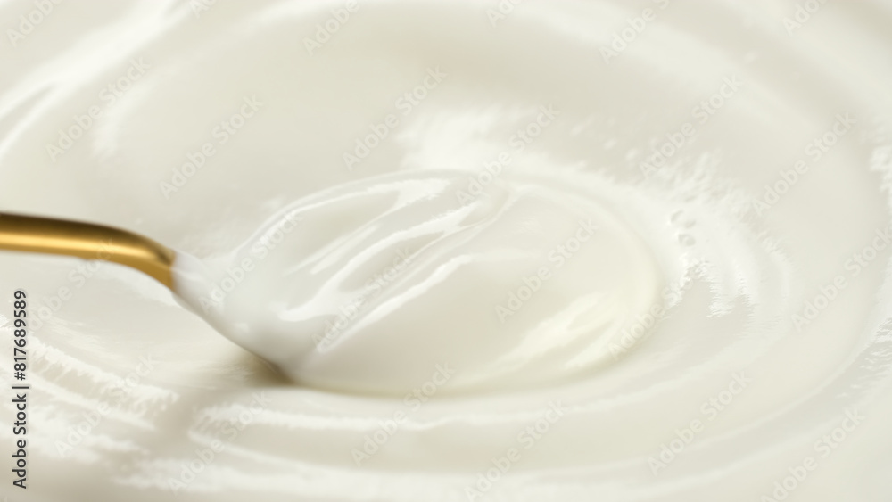 Sour cream or greek yogurt stir with spoon, close up Sour cream or greek yogurt stir with spoon, close up