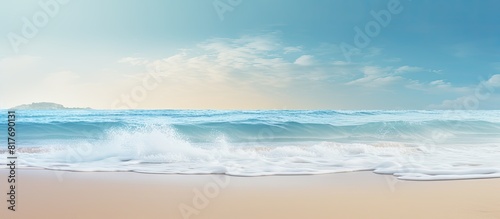 A gentle wave brushes against the sandy shore creating a serene summer background with enough room for a message. Creative banner. Copyspace image