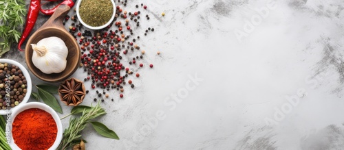 Fototapeta Naklejka Na Ścianę i Meble -  Copy space image of kitchen accessories sauce spices and herbs arranged on a light gray stone background