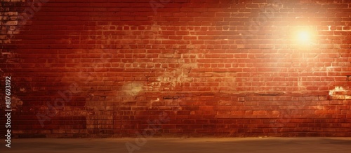 Sunlit copy space image with a grunge background of a red brick wall photo