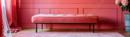 Modern living room with a soft focus on a plush pink bench against vibrant pink walls photo