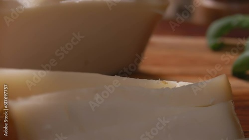 Close up of a semi hard sheep cheese pieces taken with a fork. High quality 4k footage photo