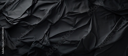 Creative Design Templates featuring a crumpled black paper for a textured background with ample copy space image