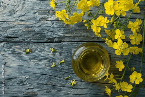 Canola oil on gray wood photo