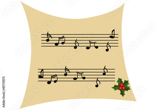 Christmas sheet music and holly branch