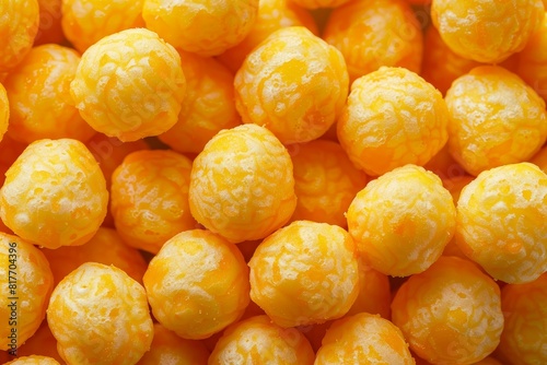 Cheese corn balls with cheese flavor Selective focus on crunchy puffed balls perfect for cinema snacks photo