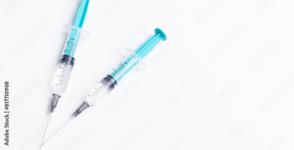 Disposable plastic syringe prepared for injection and vaccination in the hospital. The concept of medicine and health Disposable plastic syringe prepared for injection and vaccination in the hospital. The concept of medicine and health