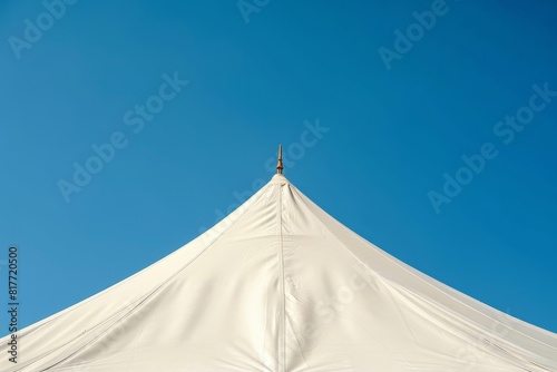 White tent canopy against blue sky for large party event