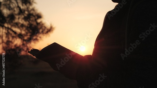 girl woman praying at sunset, hand sunset faith pain, asking heaven for help, bible book, tranquil sunset praying, young woman spirituality, divine connection sunset, spiritual growth dusk