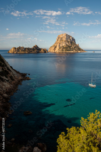 Sailboat sailing on turquoise waters around Es Vedra island, Sant Josep de Sa Talaia, Ibiza, Balearic Islands, Spain
