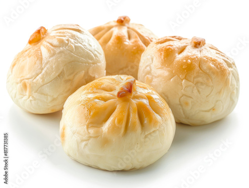Four small pastries with a golden crust and a filling photo