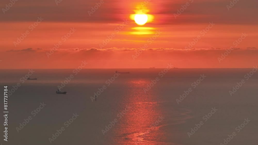 Cargo ship in the open sea at the beautiful sunset. Cargo ship in the open sea at the beautiful sunset.