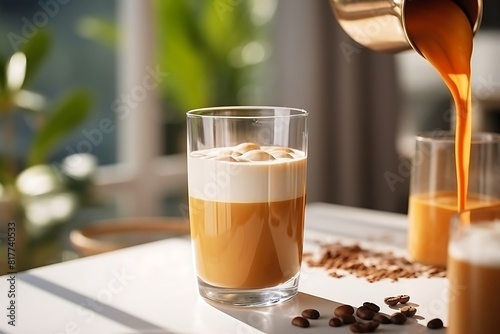 Coffee pouring from coffee machine into glass cup on white table