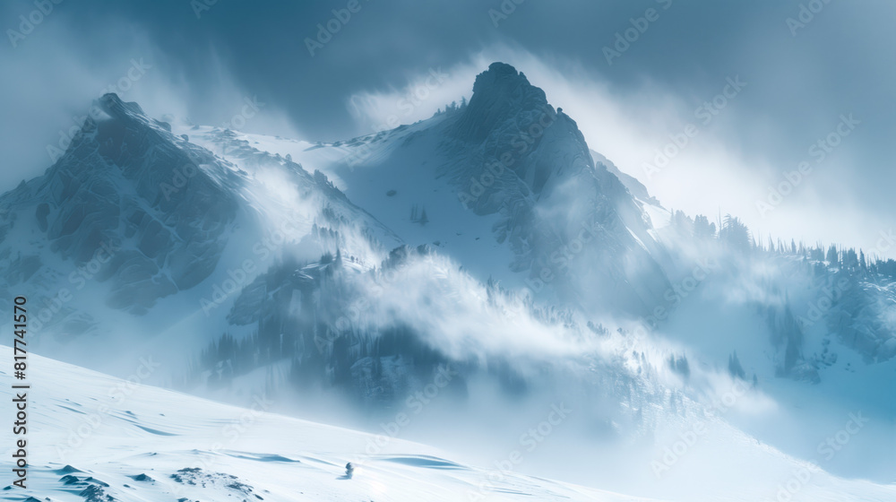 Majestic Rocky Mountains in winter with spindrift blowing from the ...