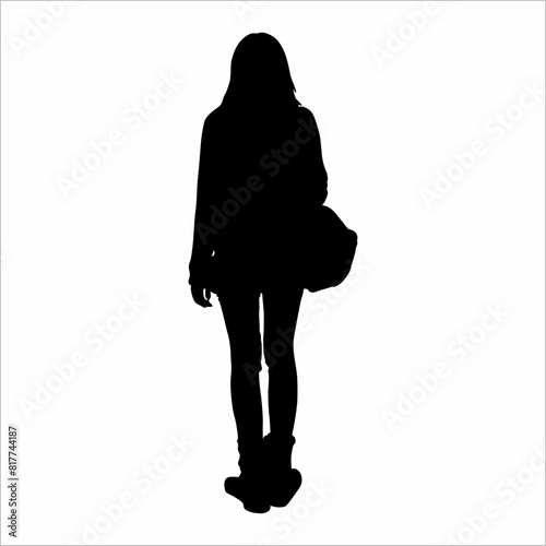 Silhouette of a woman carrying a bag