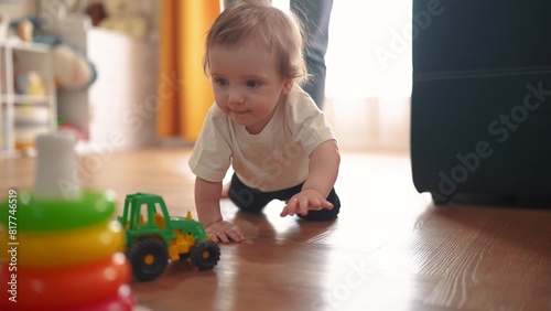 baby crawls. happy family a kid dream concept. baby crawls takes first steps to study indoors. mother teaches baby to crawl takes first steps lifestyle. children learning concept