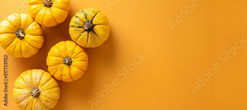 Halloween jack o  lanterns on orange backdrop with ample space for text placement photo