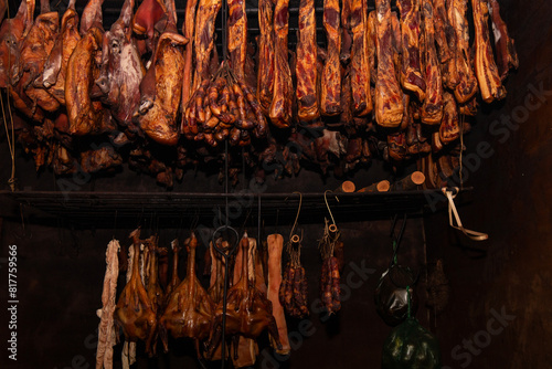 perserved pork and sausage hanging on shelf photo
