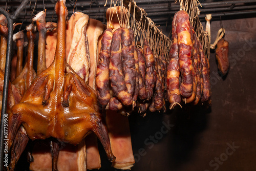 perserved pork and sausage hanging on shelf photo