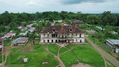 Wallpaper Mural the small village has a brown roof and white walls and is covered in greenery Torontodigital.ca
