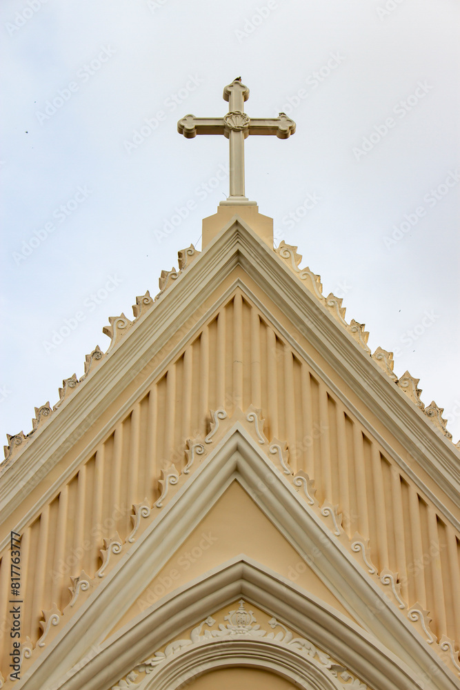 Beautiful Carving Pattern And Catholic Cross On Top Of Old Chapel. Beautiful Carving Pattern And Catholic Cross On Top Of Old Chapel.