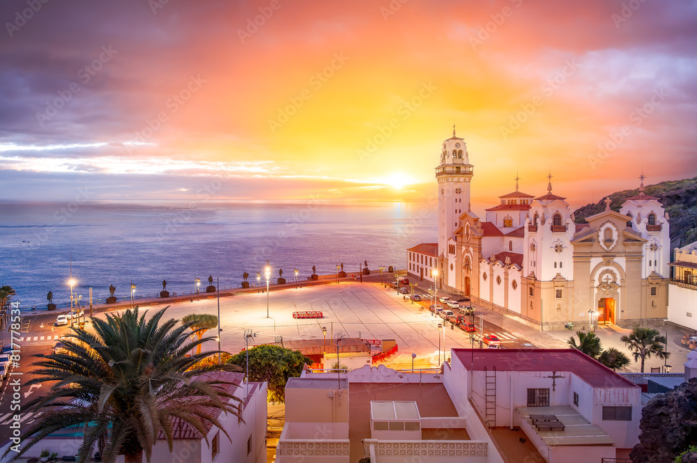 Explore the enchanting seaside town of Candelaria, Tenerife, with its historic architecture, vibrant sunrise, and stunning ocean views, perfect for travel photography.
