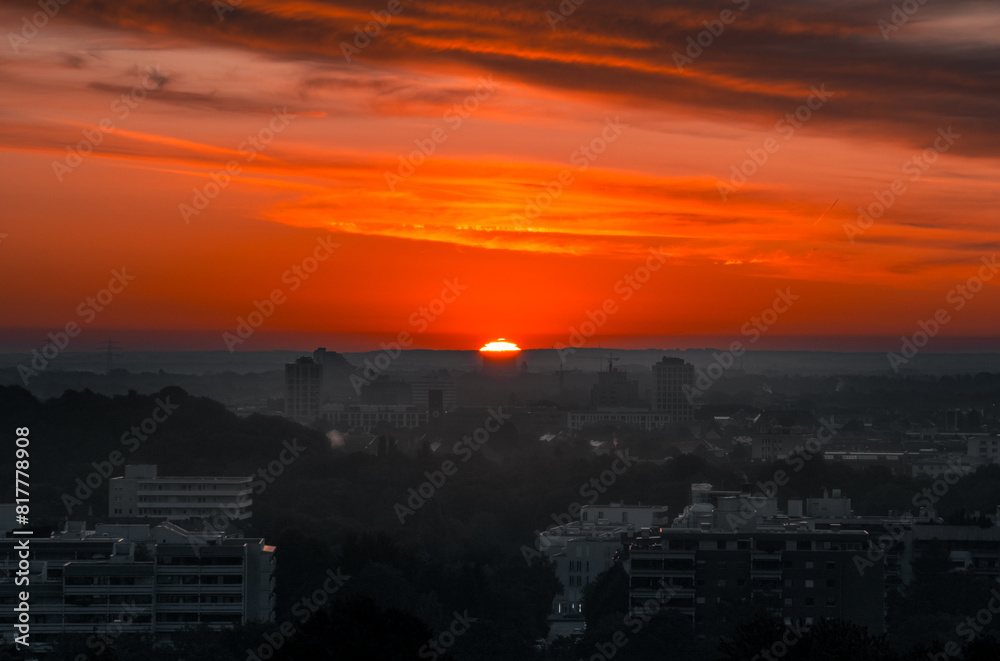 Stunning sunset illuminates the skyline of a bustling city. Munich, Germany Stunning sunset illuminates the skyline of a bustling city. Munich, Germany