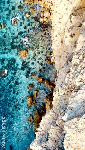 Vertical footage of the Pou des Lleo beach on a sunny day in Ibiza island, Balearic islands, Spain photo
