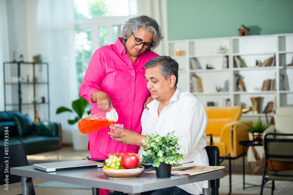 senior Indian asian mid age couple having fun during a breakfast at home. senior Indian asian mid age couple having fun during a breakfast at home.