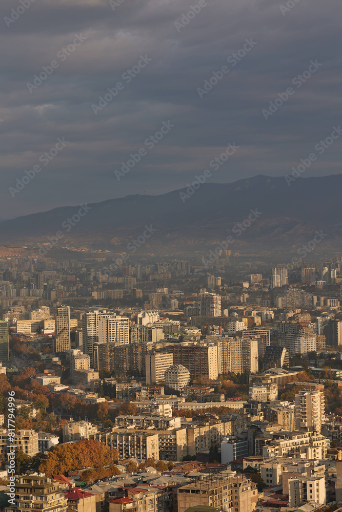 Scenic view of Tbilisi surrounded by majestic mountains in the distance at sunrise in Georgia Scenic view of Tbilisi surrounded by majestic mountains in the distance at sunrise in Georgia
