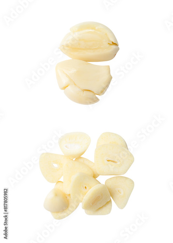 Top view set of fresh peeled pounded garlic cloves with slices in stack isolated on white background with clipping path