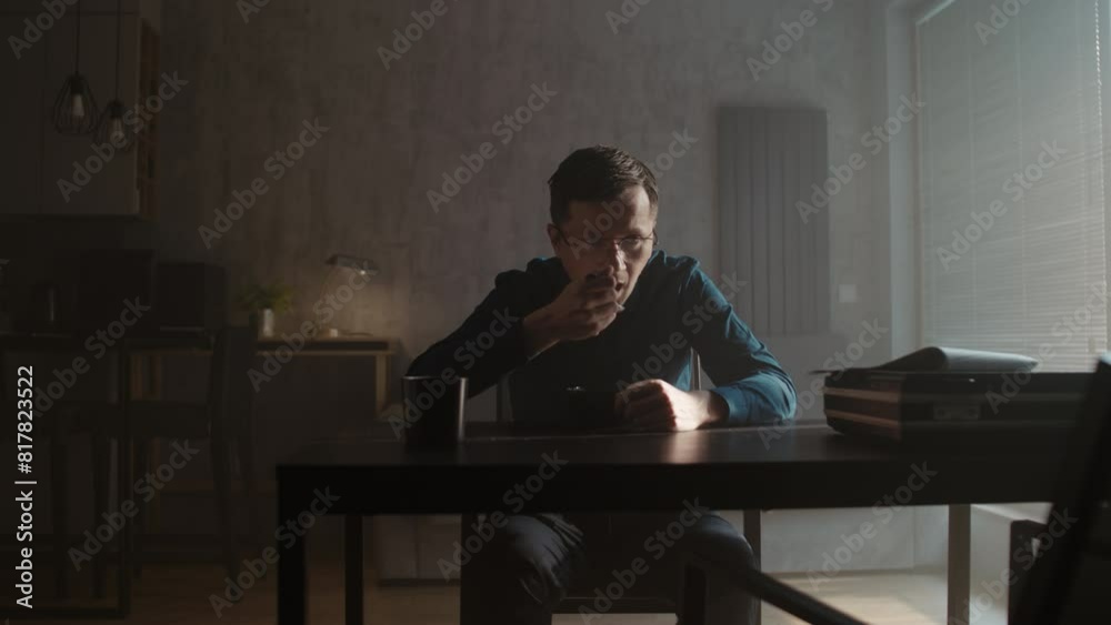 A sad man eats cereal for breakfast A sad man eats cereal for breakfast