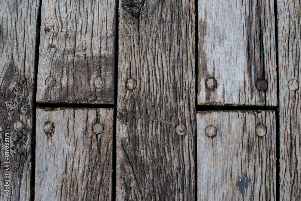 old wooden fence has some nails on it with nails missing old wooden fence has some nails on it with nails missing