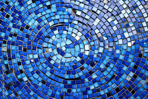 A blue mosaic tile wall with a blue and white swirl pattern.