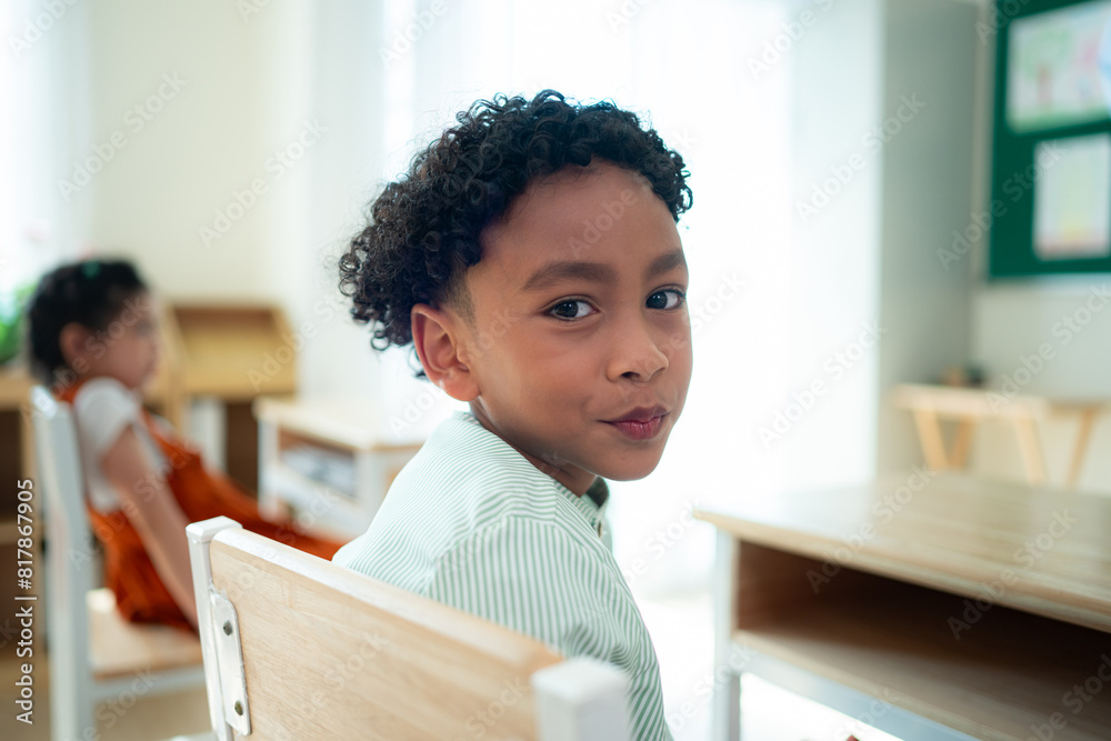 Fototapeta premium Teacher and students, Learn and study in a classroom of school where youngsters sit and listen attentively.