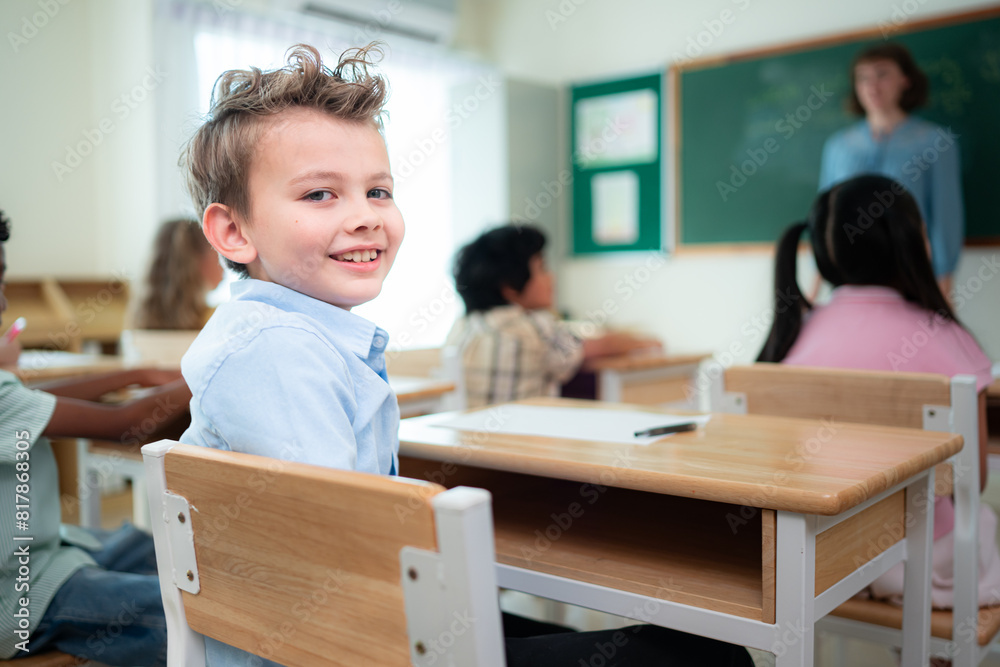 Teacher and students, Learn and study in a classroom of school where youngsters sit and listen attentively. Teacher and students, Learn and study in a classroom of school where youngsters sit and listen attentively.