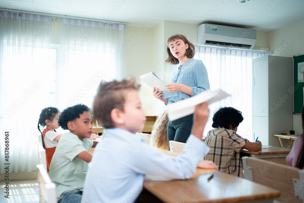 Teacher and students, Learn and study in a classroom of school where youngsters sit and listen attentively. Teacher and students, Learn and study in a classroom of school where youngsters sit and listen attentively.