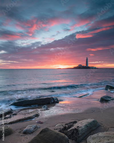 Sunrise over St Mary's Lighthouse and island at Whitley Bay on the north east coast of England, UK.