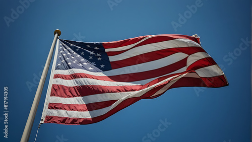 American Flag Waving on Sunny Day Against Clear Blue Sky