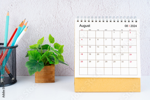 August 2024 Desk Calendar with pencil.