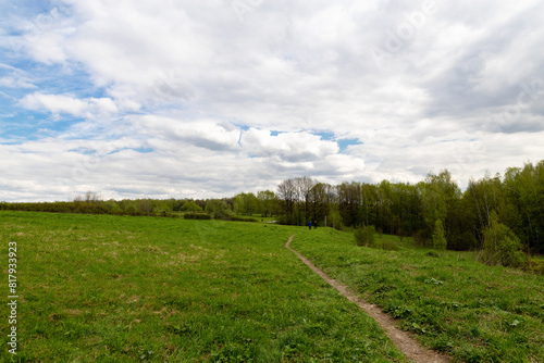 Spring landscape meadows with clouds